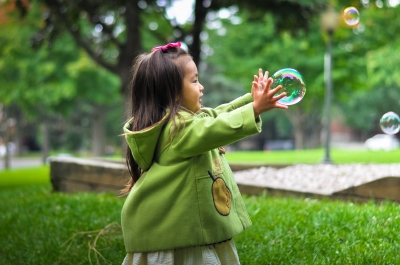 Japanese girl playing with bubbles