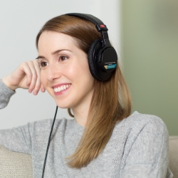 Woman listening to german grammar audiobook